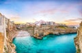 Stunning sunset at Cala Paura gulf with Bastione di Santo Stefano and Lama Monachile beach in background