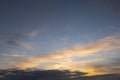 Stunning sunset cloudy sky. Low sun illuminates clouds in warm color. Nature background