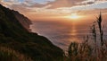 Stunning sunset with dramatic cloudy sky above wild Atlantic Ocean in the west of Madeira island, Portugal. Royalty Free Stock Photo