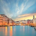 Stunning sunset and evening cityscape of Venice with famous Canal Grande and Rialto Bridge Royalty Free Stock Photo