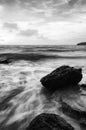 Stunning sunset moment seascape,soft wave hitting the rock over cloudy sky Royalty Free Stock Photo