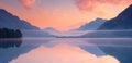 Stunning sunset over a calm lake reflecting vibrant hues of pink and orange mountains.