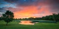 A Stunning Sunset Over a Golf Course With a Pond Royalty Free Stock Photo