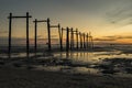 Stunning sunset seascape with abandon pier structure