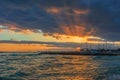 Stunning sunset with rays of sunlight shining through storm clouds in Oahu, Hawaii Royalty Free Stock Photo