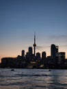 Stunning sunset view of the Toronto skyline across the tranquil lake