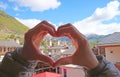 Svan Tower-houses of Mestia Town with Hands Making Heart Sign in Foreground, Caucasus, Georgia Royalty Free Stock Photo