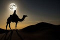 Stunning tuareg riding a camel in desert at night with super moon in background. Generative Ai