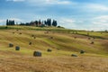 Stunning Tuscany landscape, typical stone house and hay bale on the hills,near Val d`Orcia, Italy, Europe