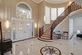 Stunning two story entry foyer with marble mosaic tiled floor