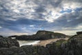 Stunning Twr Mawr lighthouse landscape from beach with dramatic