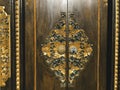 Stunning typical balinese door with wood and golden ornaments Royalty Free Stock Photo