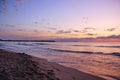 Stunning vibrant Gold sunrise on the sand beach .Orange sunrise color