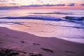 Stunning vibrant Gold sunrise on the sand beach .Orange sunrise color