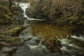 Stunning vibrant landscape image of Aira Force Upper Falls in Lake District during colorful Autumn showing Royalty Free Stock Photo