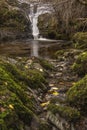 Stunning vibrant landscape image of Aira Force Upper Falls in Lake District during colorful Autumn showing