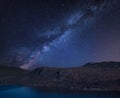 Stunning vibrant Milky Way composite image over Catbells near Derwent Water in the Lake District towards Blencathra and Skiddaw Royalty Free Stock Photo