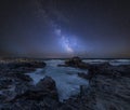 Vibrant Milky Way composite image over landscape of Cornwall coastline in England