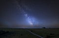 Vibrant Milky Way composite image over landscape of English countryside