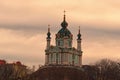 Stunning view of ancient St. Andrew`s Church or the Cathedral of St. Andrew against colorful vibrant sky during sunset