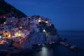 Stunning view of the beautiful and cozy village of Manarola in the Cinque Terre National Park at night. Liguria, Italy. Royalty Free Stock Photo