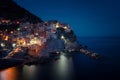 Stunning view of the beautiful and cozy village of Manarola in the Cinque Terre National Park at night. Liguria, Italy. Royalty Free Stock Photo