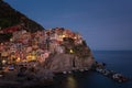 Stunning view of the beautiful and cozy village of Manarola in the Cinque Terre National Park at night. Liguria, Italy. Royalty Free Stock Photo