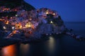 Stunning view of the beautiful and cozy village of Manarola in the Cinque Terre National Park at night. Liguria, Italy. Royalty Free Stock Photo