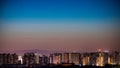 Stunning view of a bustling cityscape illuminated by bright city lights at night