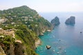 Stunning view of Capri island in a beautiful summer day with Faraglioni rocks Capri, Italy Royalty Free Stock Photo