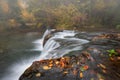 Stunning view of a cascading waterfall situated in Lazio, Italy with beautiful warm autumn colors Royalty Free Stock Photo