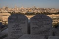 Stunning view of the city of Jerusalem, with two headstones atop a hill