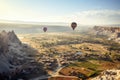 A stunning view of a group of hot air balloons traveling gracefully over a picturesque valley, View from a baloon ride over