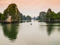 Halong Bay karst formations reflected in the emerald waters of Tonkin gulf, Vietnam