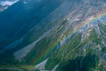 Stunning view on the high mountain after the rain with colorful rainbow over the rocky mountain and glacier in Mt Cook National Royalty Free Stock Photo