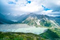 Stunning view on the high mountain after the rain with colorful rainbow over the rocky mountain and glacier in Mt Cook National Royalty Free Stock Photo