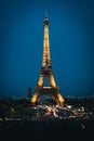 Stunning view of the iconic Eiffel Tower in Paris, France, illuminated at night