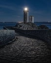 Stunning view of Le Phare du Petit Minou lighthouse at night with bright top in Plouzane, France Royalty Free Stock Photo
