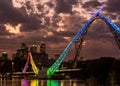 Stunning view of the Matagarup bridge lit up with a rainbow of vibrant colors across the night sky