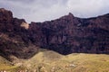 Stunning view of mountains and volcanic rocky hills in Gran Canaria, Spain. Between the mountains is a green valley. The sky is Royalty Free Stock Photo