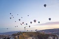 Stunning view of numerous colourful balloons flying in the air during calm sunrise. Cappadocia - one of the most popular