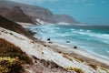 Stunning view over barren rugged volcanic cliffs and sand dunes. Vast plain of the coastline. Baia Das Gatas. North of Royalty Free Stock Photo