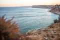 Stunning view over Praia do Camilo in Lagos, Algarve Portugal during the sunrise. Rocks, cliffs and formations in the ocean.