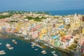 Stunning view of Procida in sunny summer day. Colorful houses, fishing boats and yachts in Marina Corricella, Procida Island,