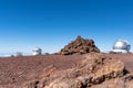 Stunning view of a religious stone shrine on the summit of Mauna Kea volcano 4205 m on the Big Island of Hawaii. Astronomical ob Royalty Free Stock Photo