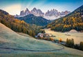 Stunning view of Santa Magdalena village with Chiesetta di San Giovanni in Ranui church in front of the Geisler. Gorgeous autumn s Royalty Free Stock Photo