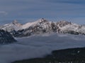 Stunning view of Franchere Peak with rock face in late autumn above a sea of clouds and forests in Jasper National Park, Canada. Royalty Free Stock Photo