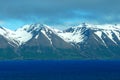 The stunning view of the snowy mountain and blue fjord in the summer near Olafsfjordur, Iceland