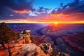 A stunning view of the sun setting over the Grand Canyon, illuminating its awe-inspiring landscape with a golden glow, A panoramic Royalty Free Stock Photo