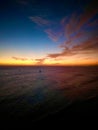 Stunning view of a sunrise illuminating the horizon over the vast expanse of the ocean in Hawai Royalty Free Stock Photo